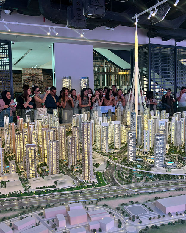 Crowd at EMAAR Valia EOI event gathered around the project model at Dubai Creek Harbour